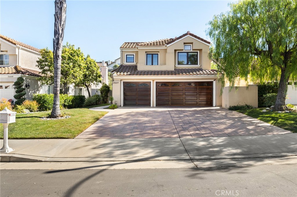 a front view of a house with yard