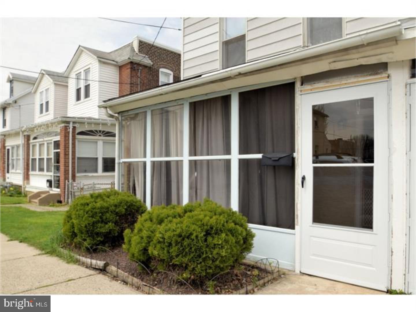 a view of a house with a window and yard