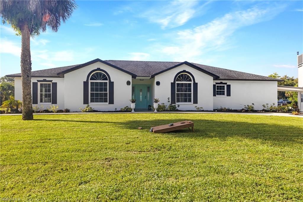 Ranch-style home with a front yard