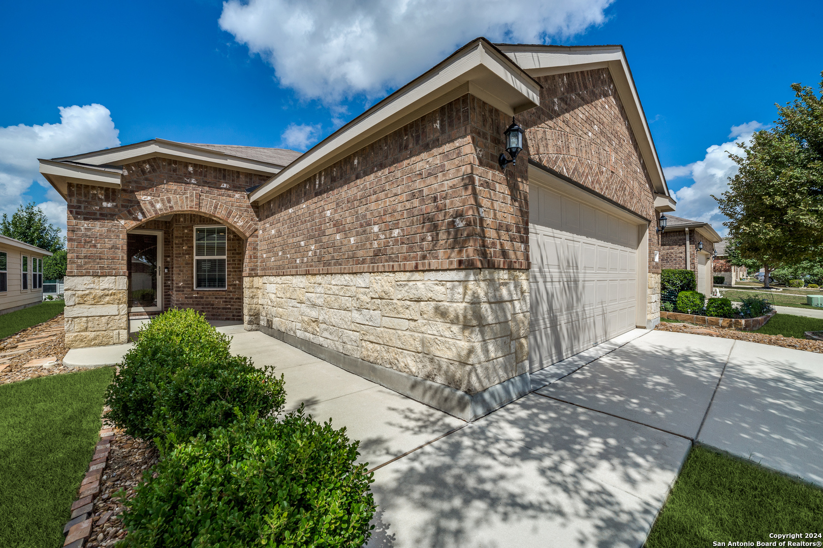 a front view of a house with a yard