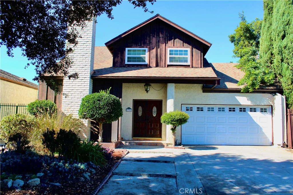 a front view of a house with yard