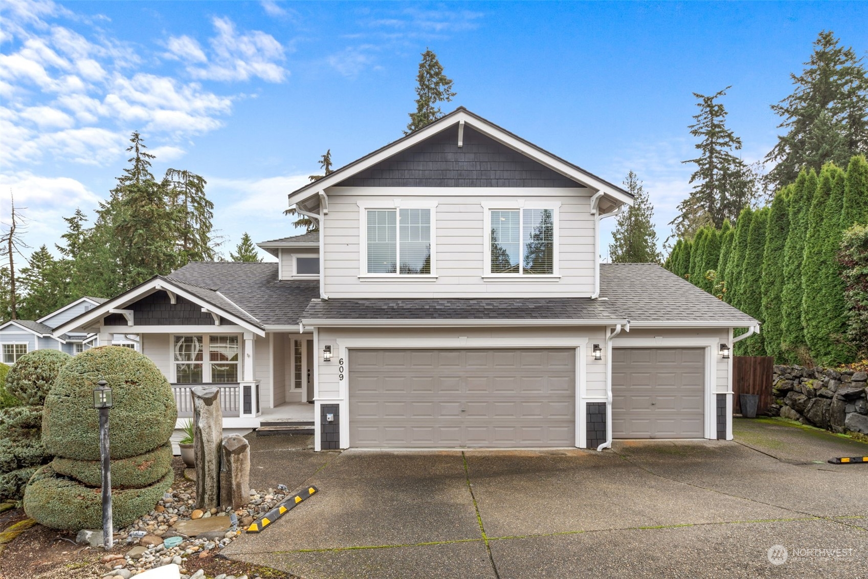 a front view of a house with garage