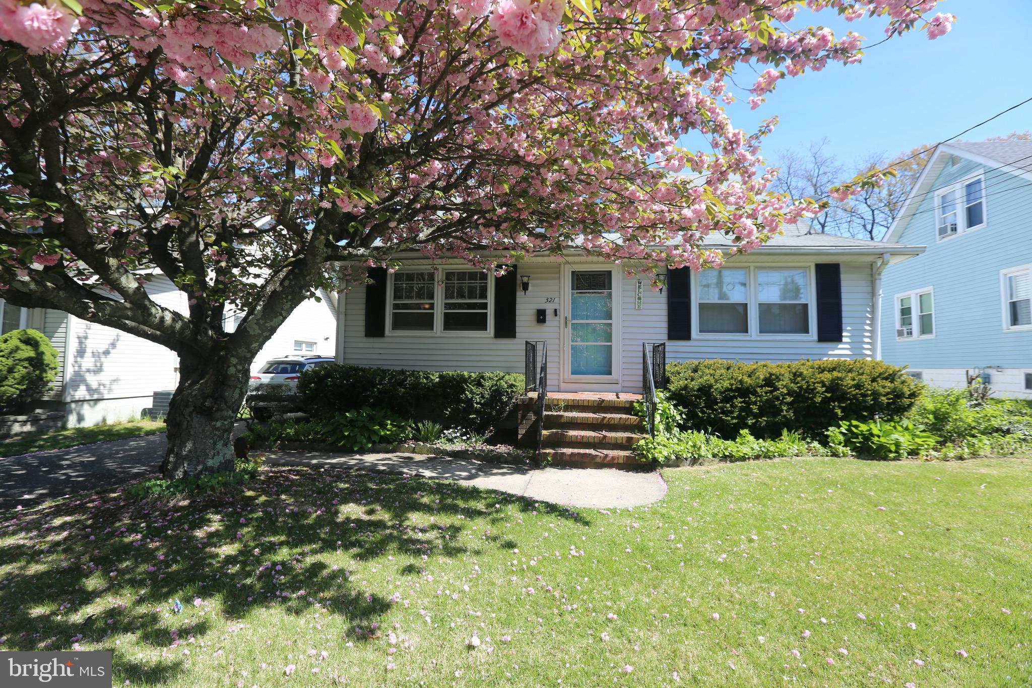 front view of a house with a yard