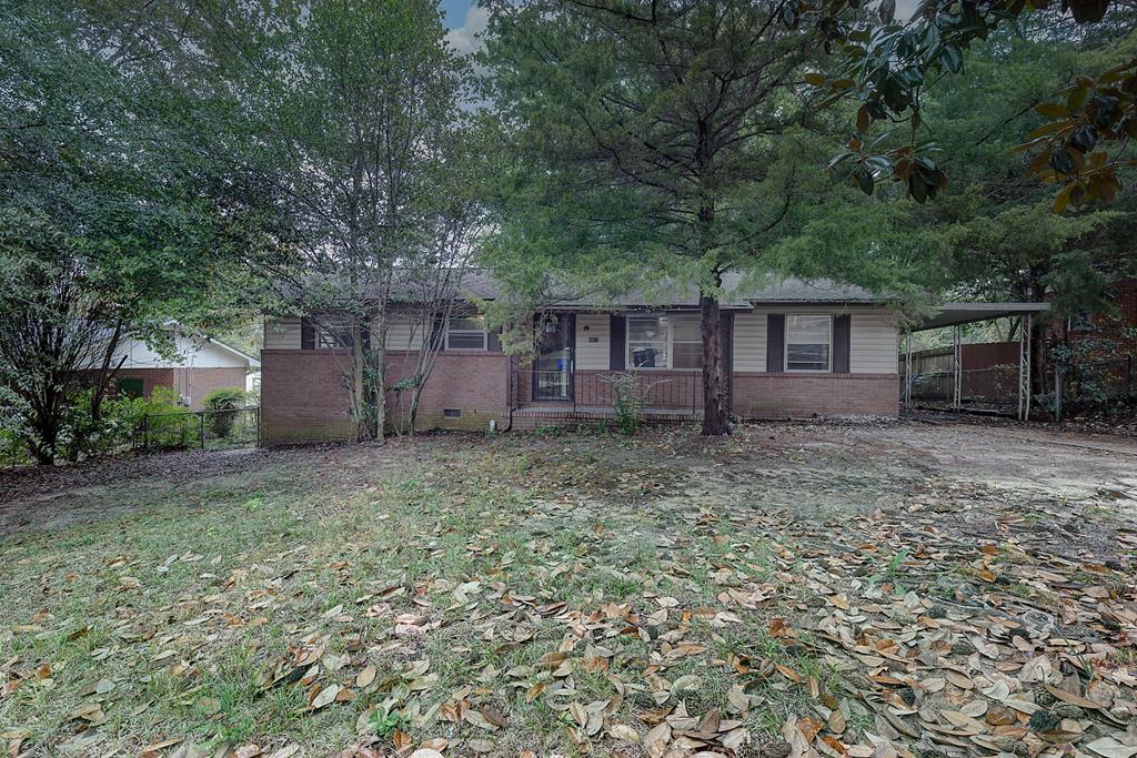 front view of a house with a yard