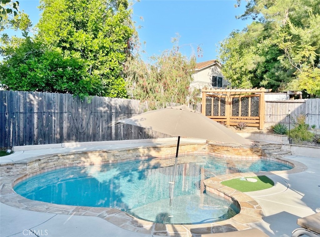 a view of a swimming pool with a patio