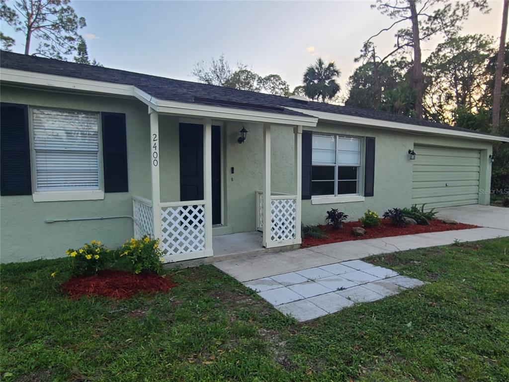 a view of a house with a back yard