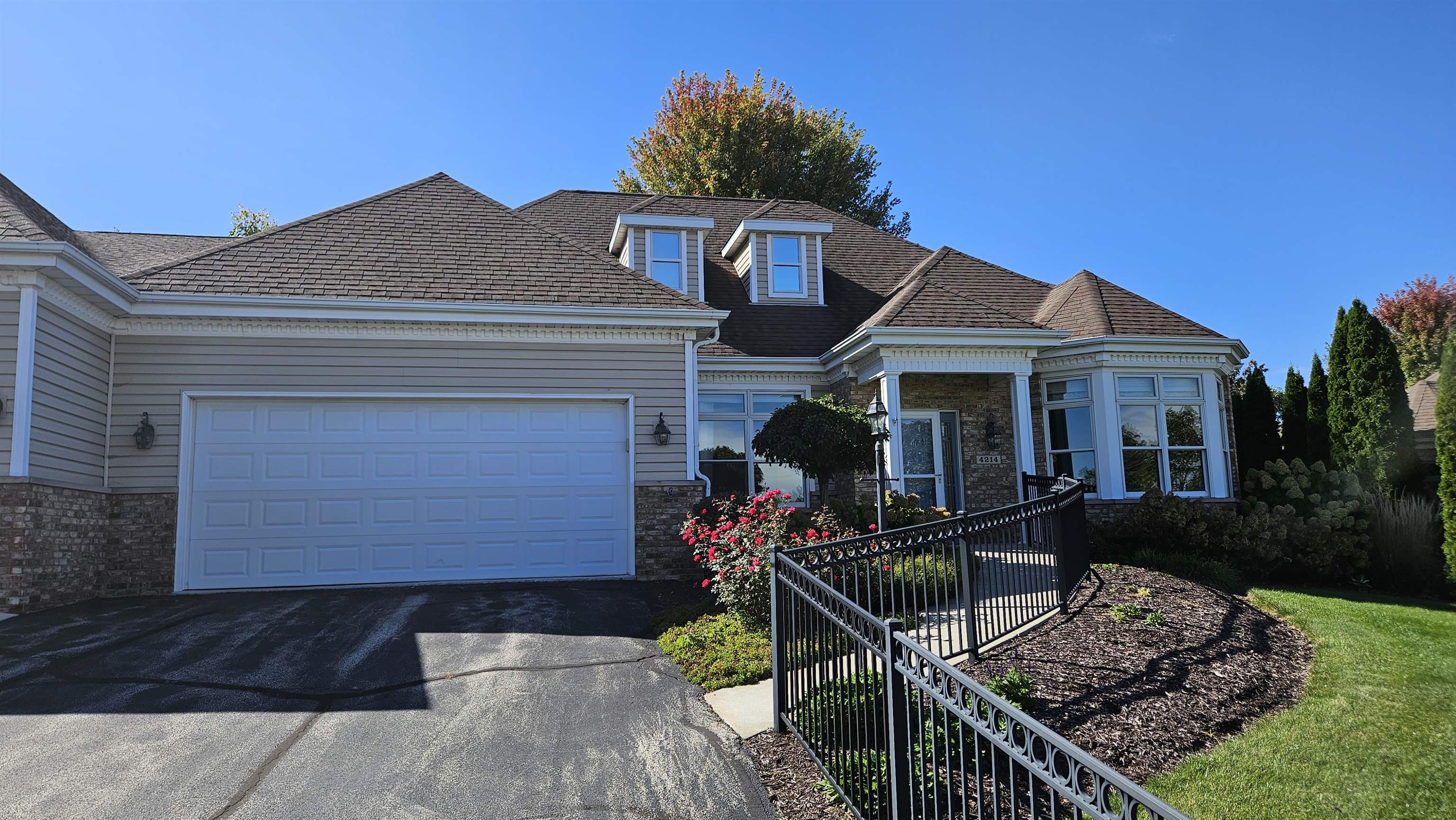 a front view of house with yard outdoor seating and barbeque oven