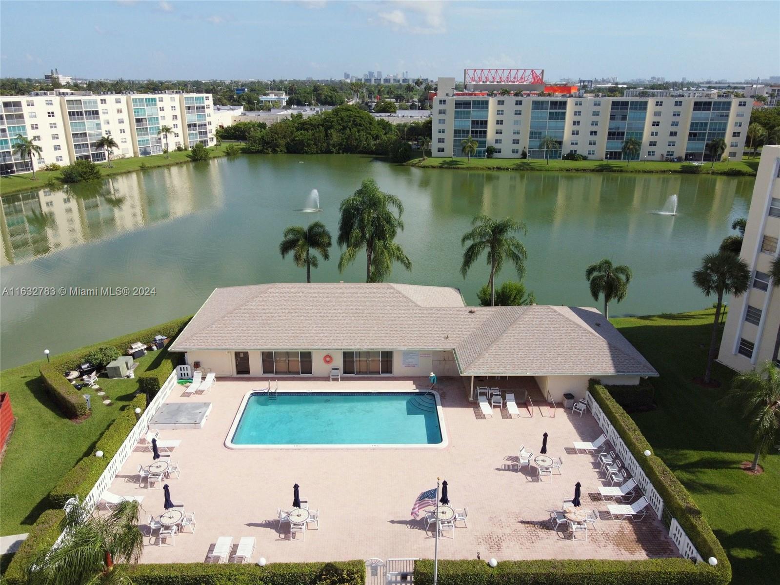 an aerial view of a house with a lake view