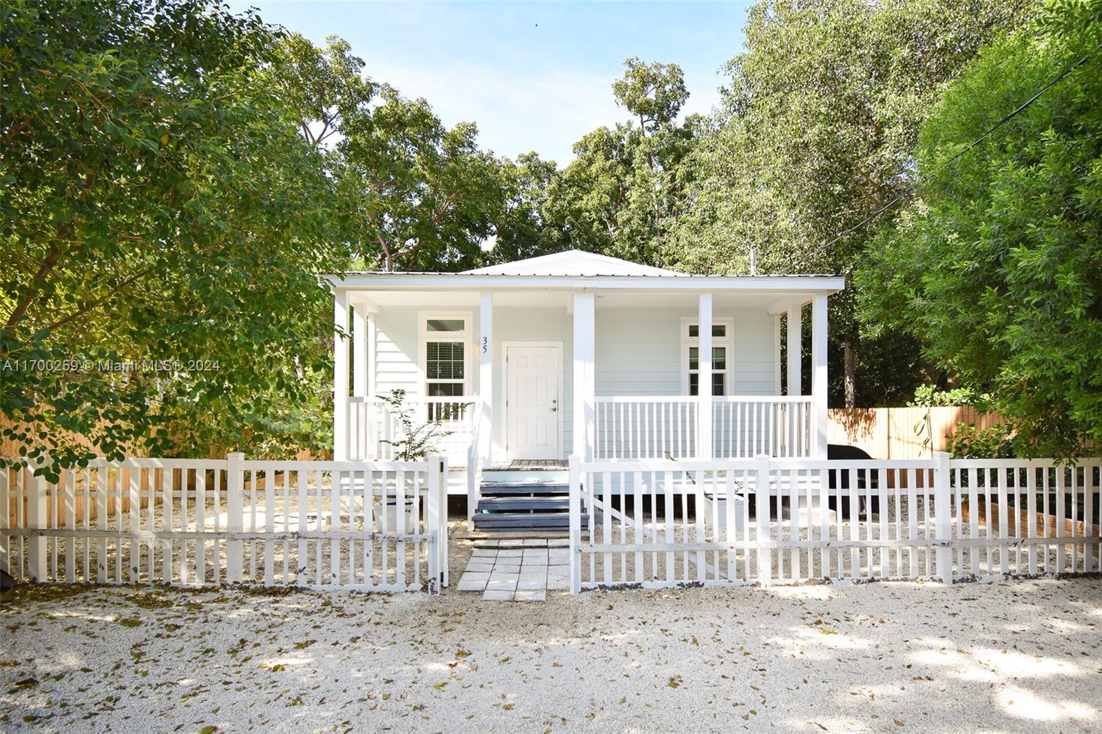 a front view of a house with a small yard