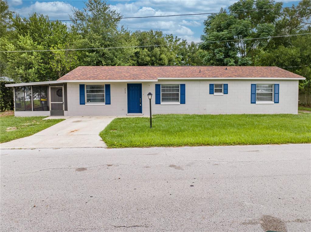 a view of a yard in front view of a house