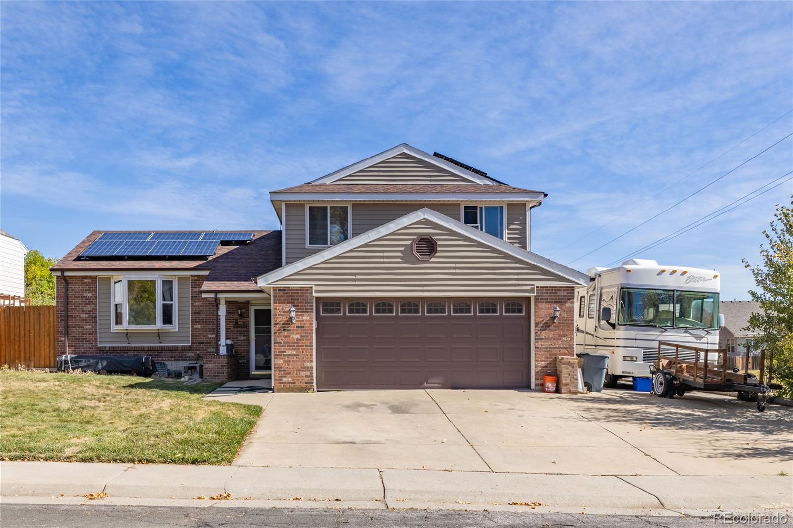 a front view of a house with a garage