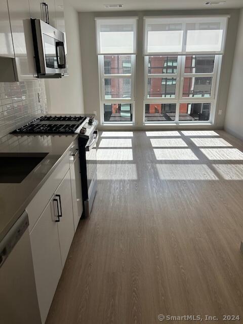 a kitchen that has a sink and a stove