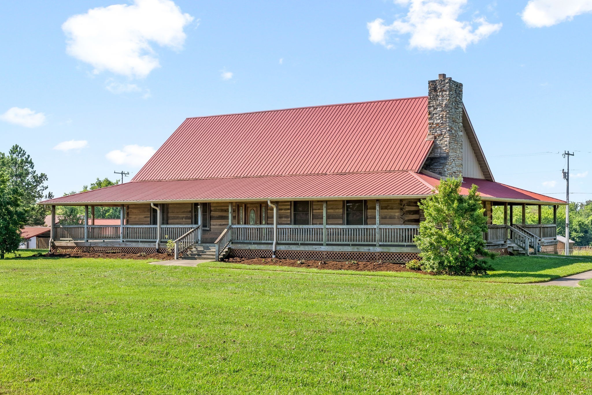 a view of a house with a yard porch and sitting area