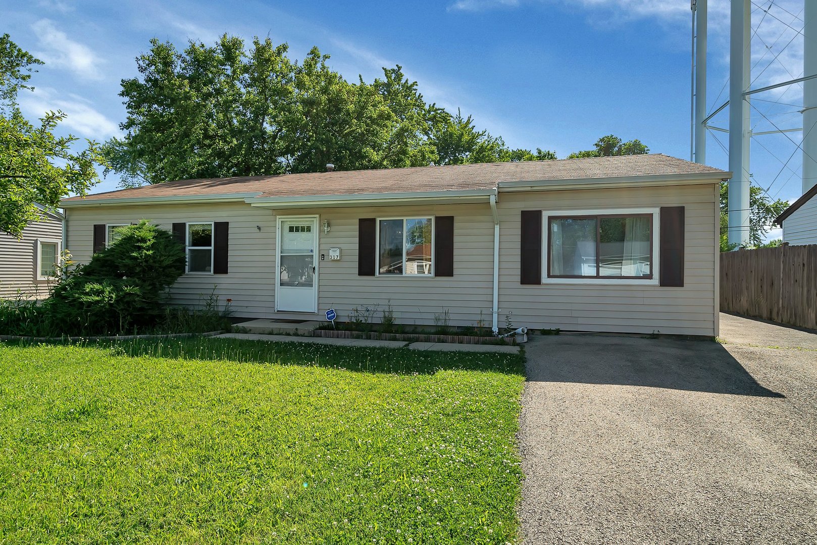 front view of a house with a yard