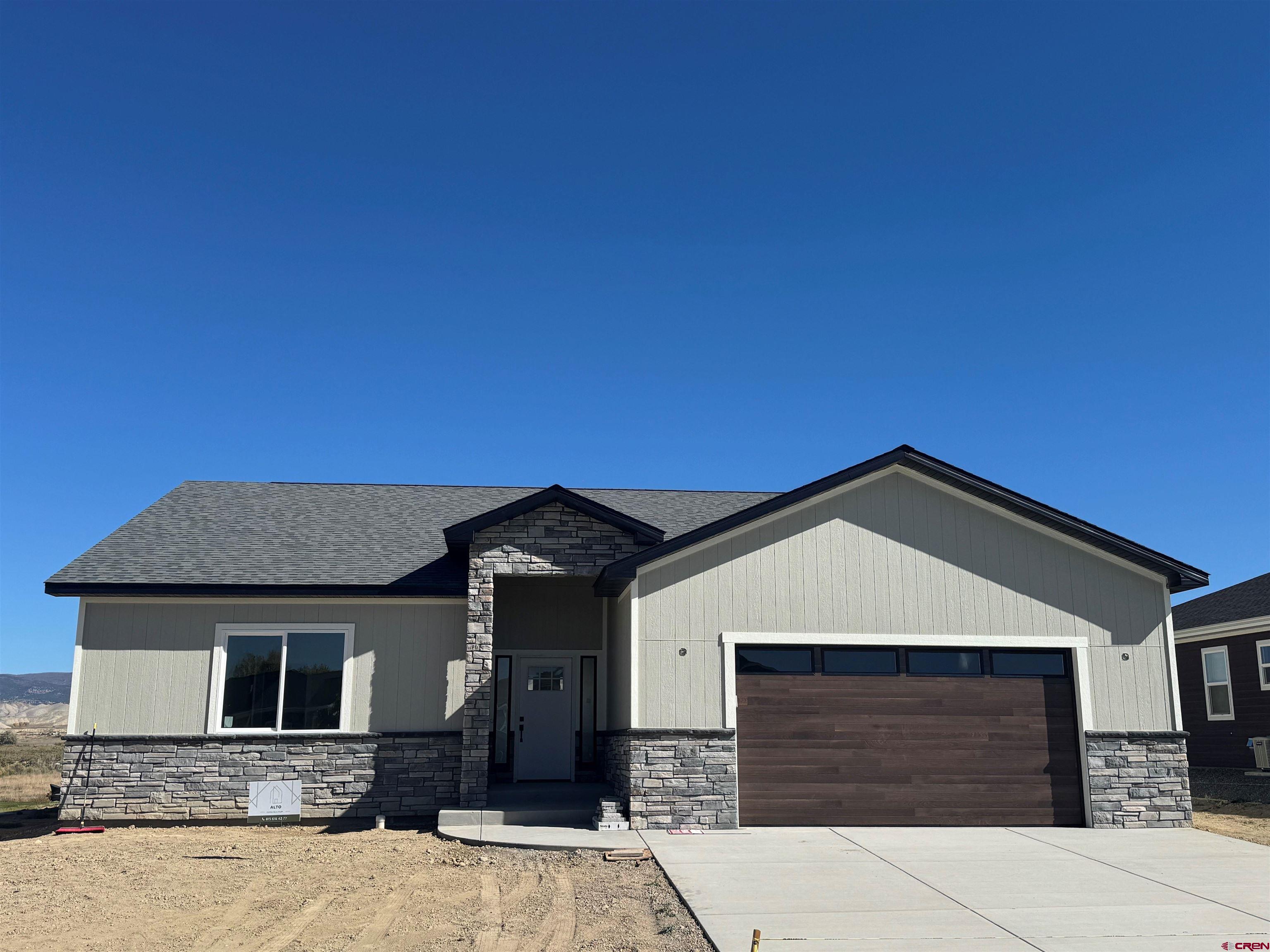 a front view of a house with a garage