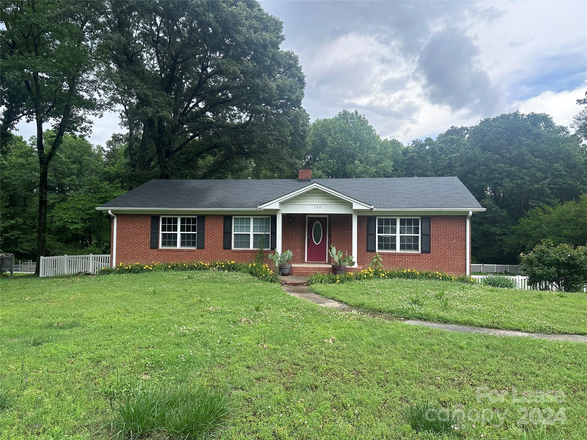 a front of a house with a garden