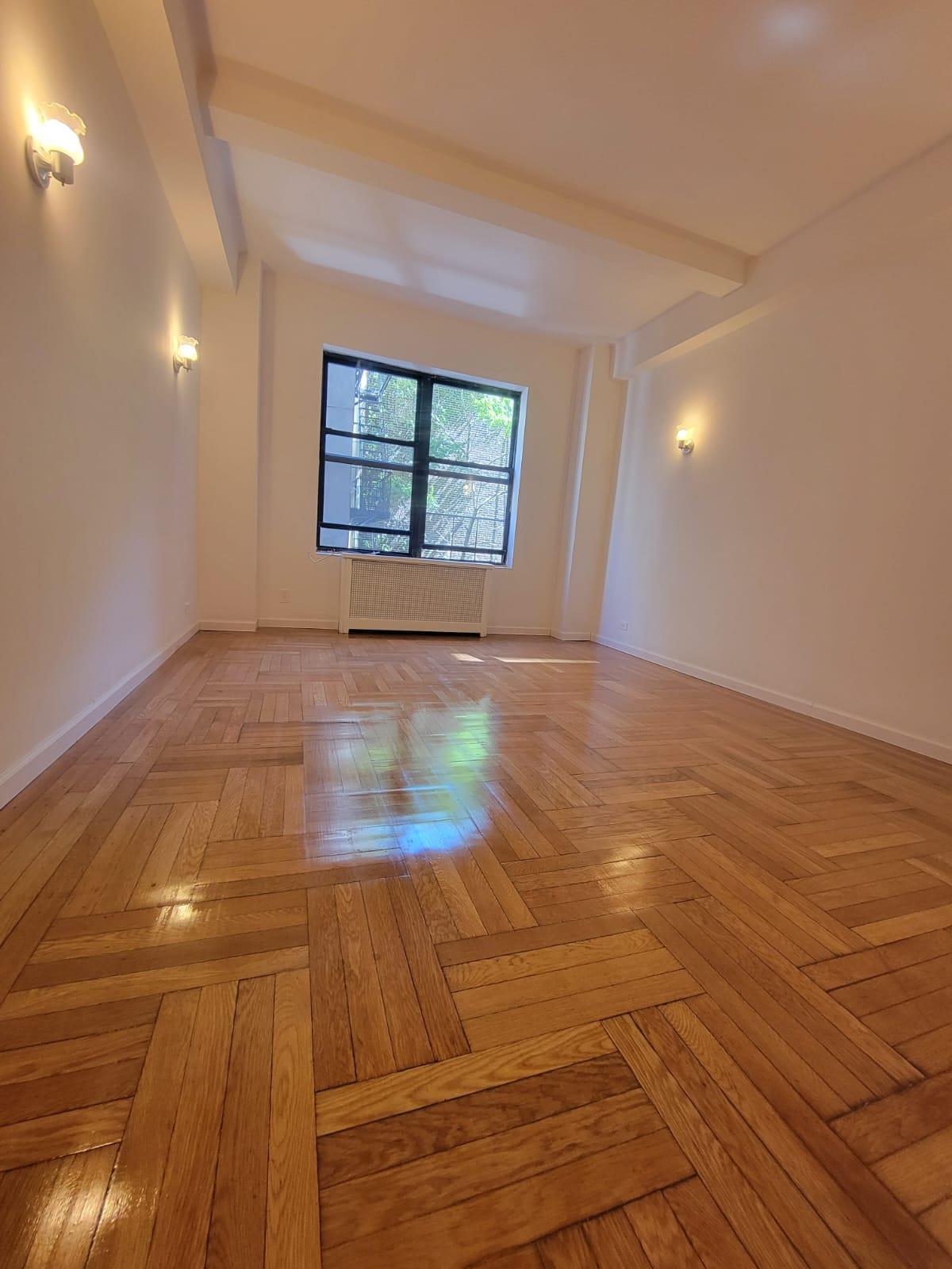 a view of an empty room and window