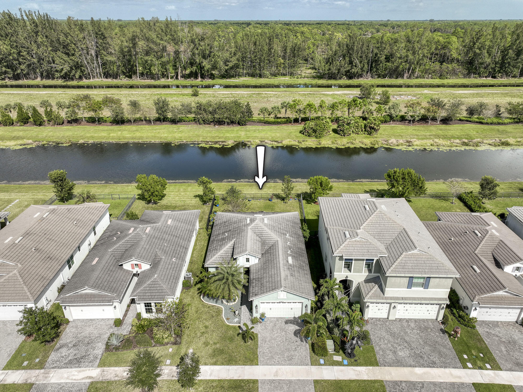 an aerial view of a house with a lake view