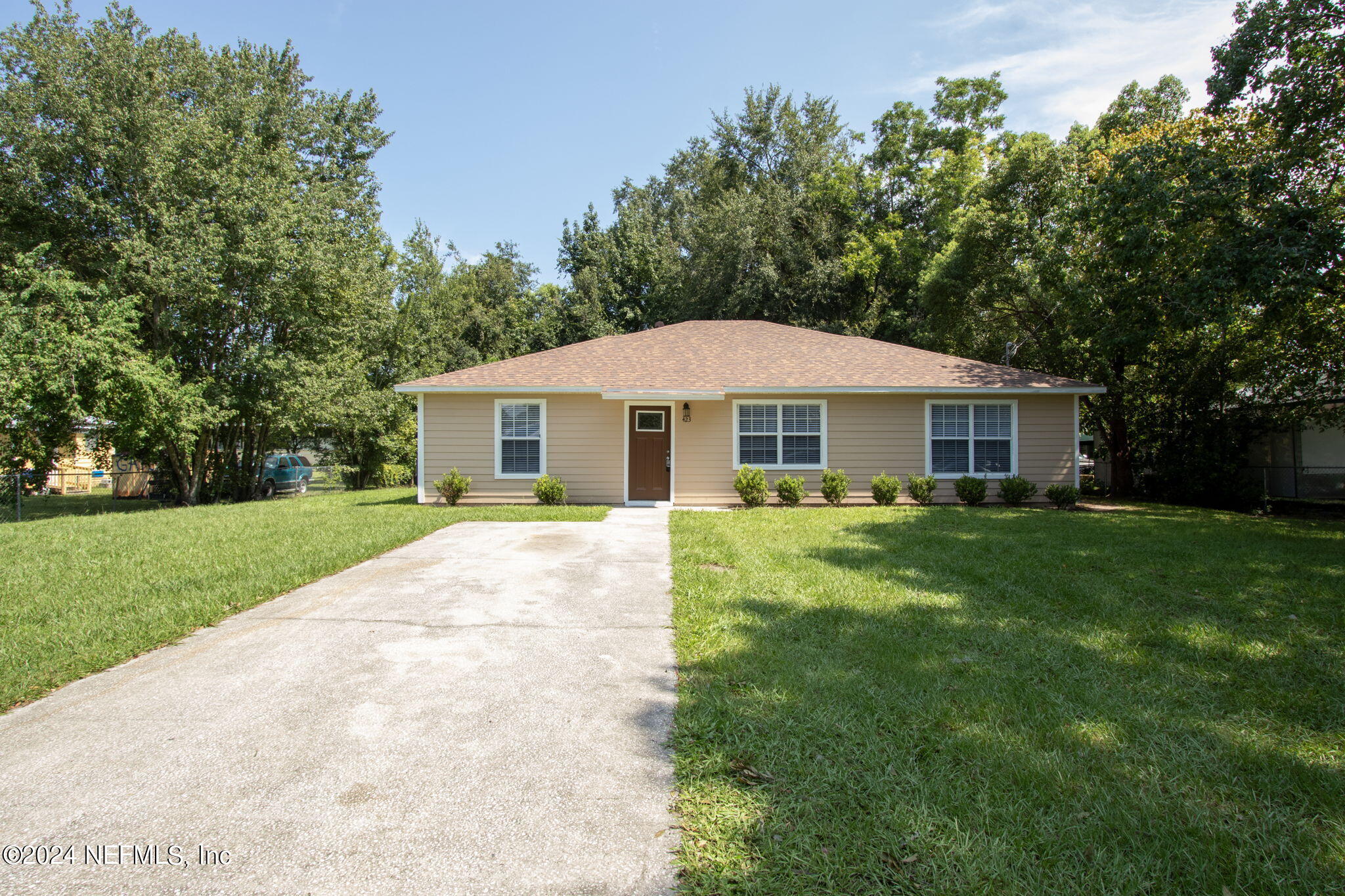 a front view of a house with a yard