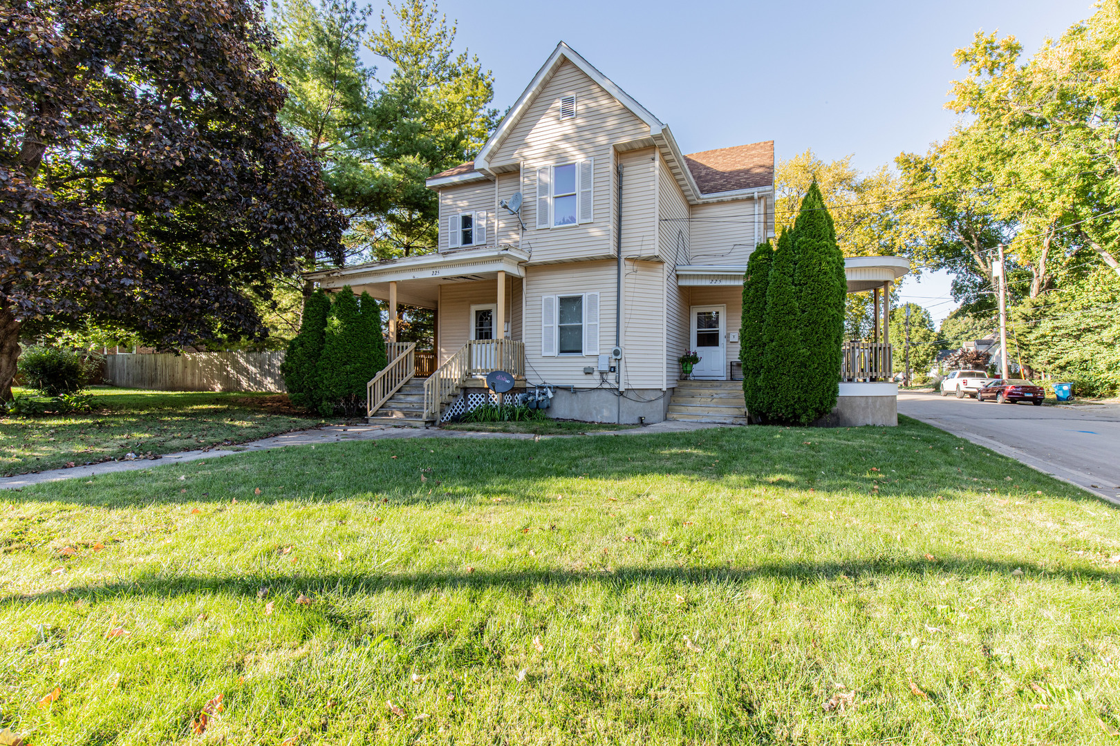 a front view of house with yard and green space