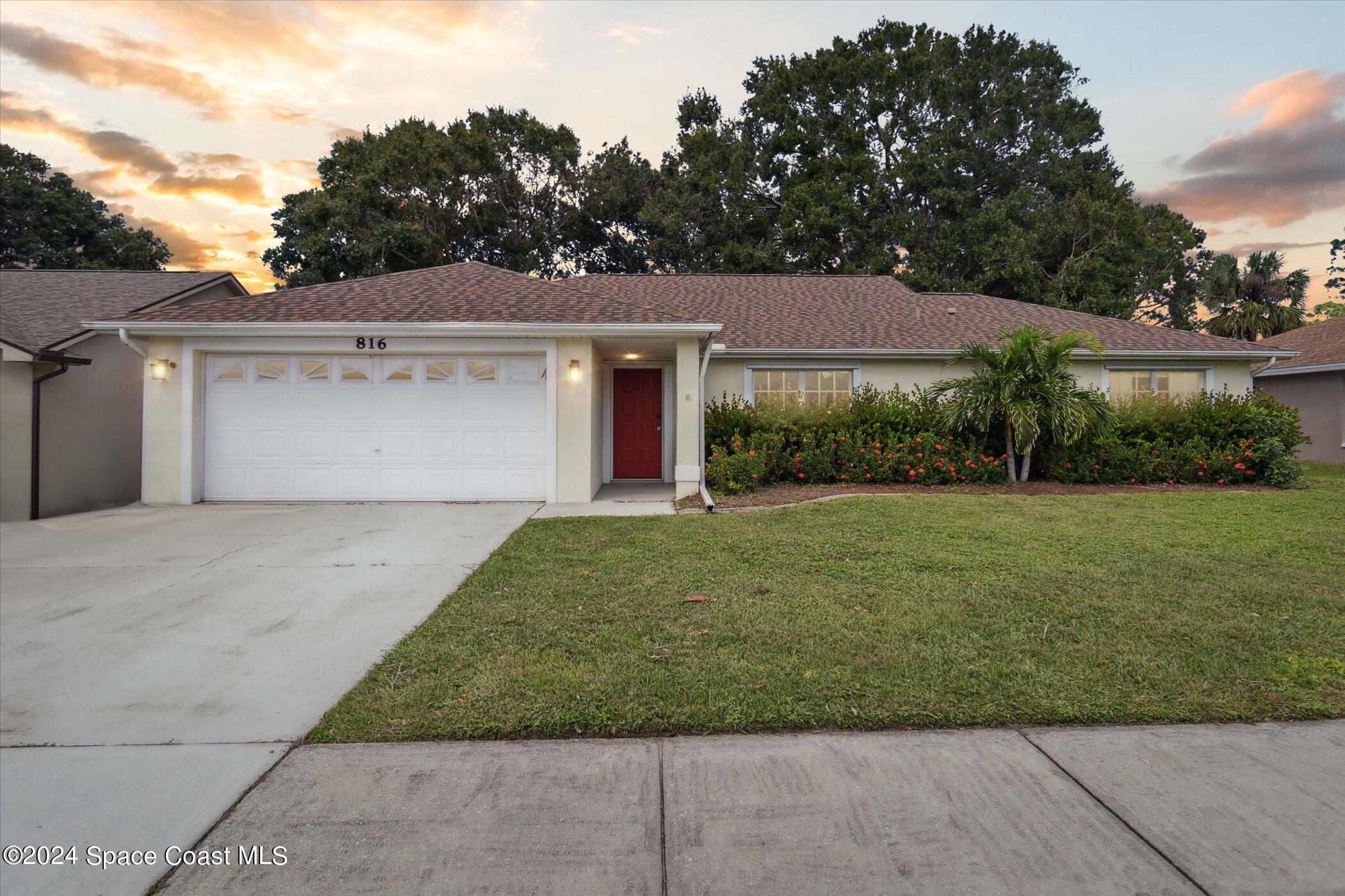 front view of a house with a yard