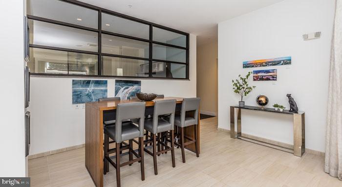 a dining room with wooden floor and breakfast area