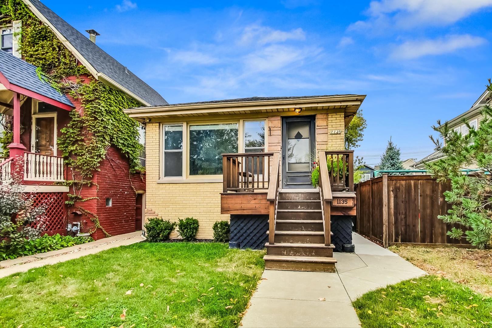 a front view of a house with stairs