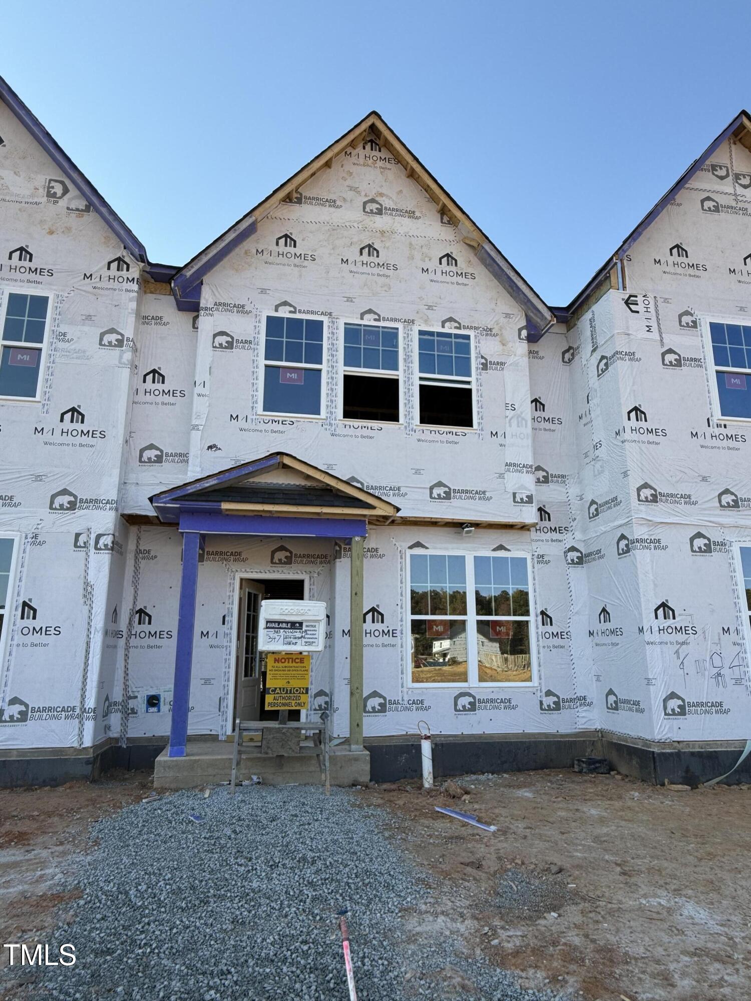 a front view of a house with a garage