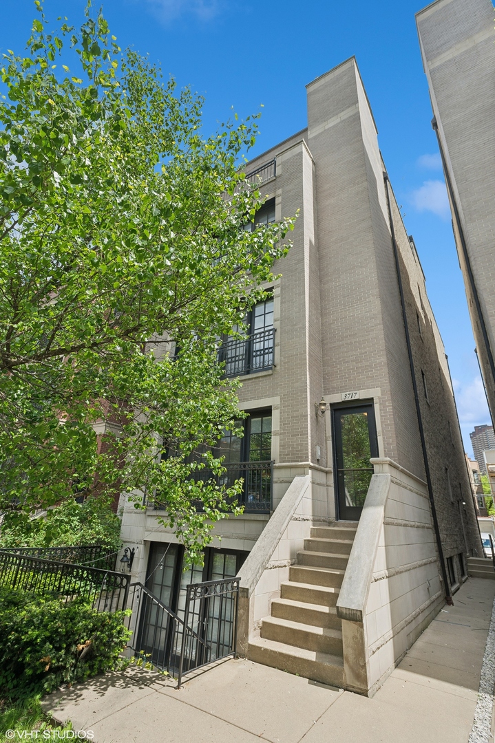 a view of a building with a yard