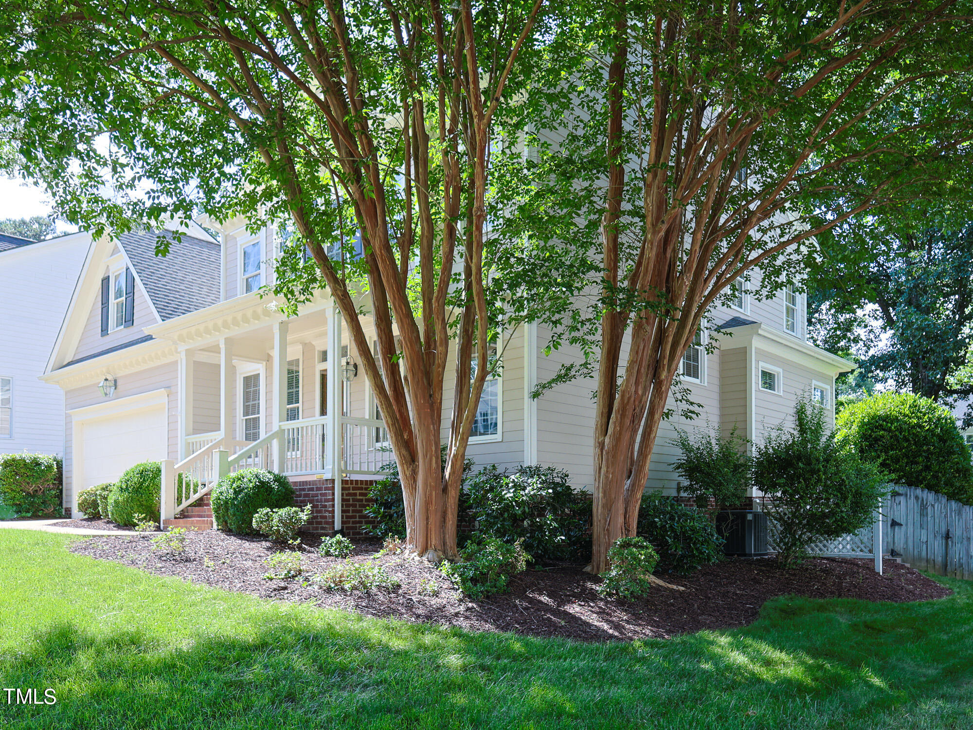 a view of a front of house with a tree