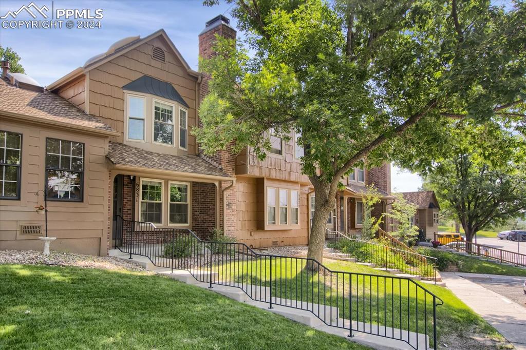 front view of a house with a yard