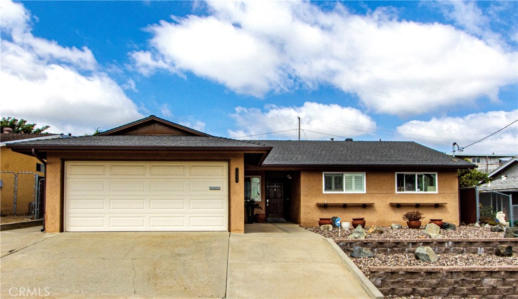 a front view of a house with yard