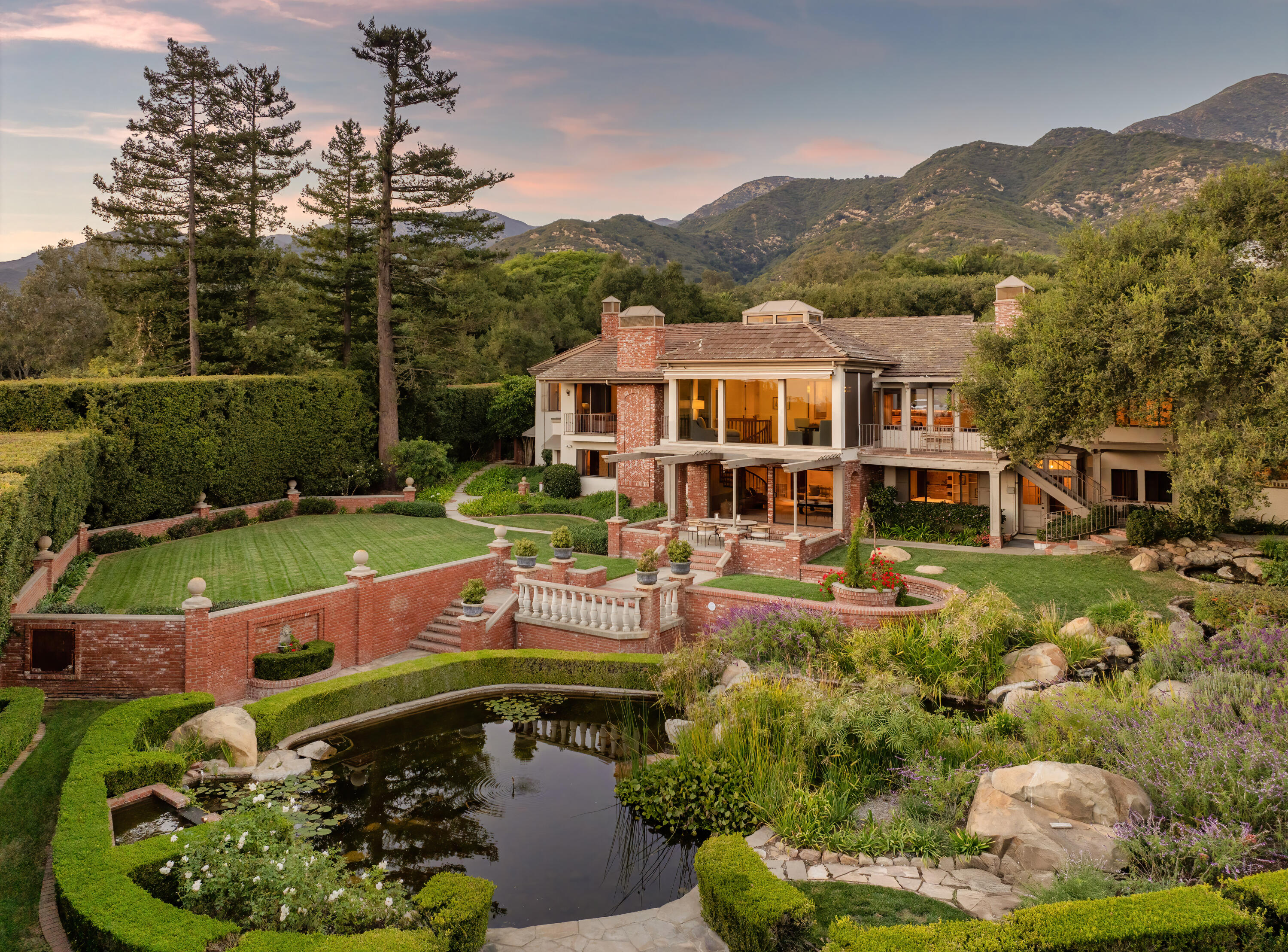 a view of a swimming pool with a patio and a garden