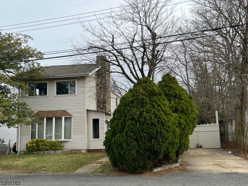 a view of a house with a garden