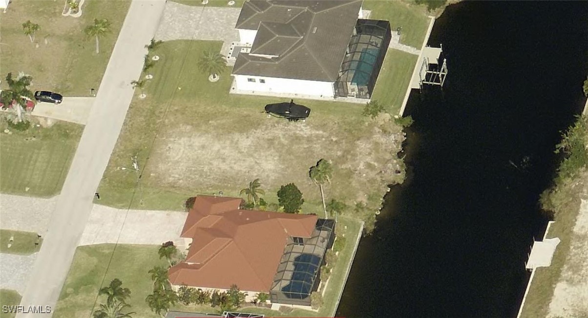 an aerial view of a residential houses with outdoor space