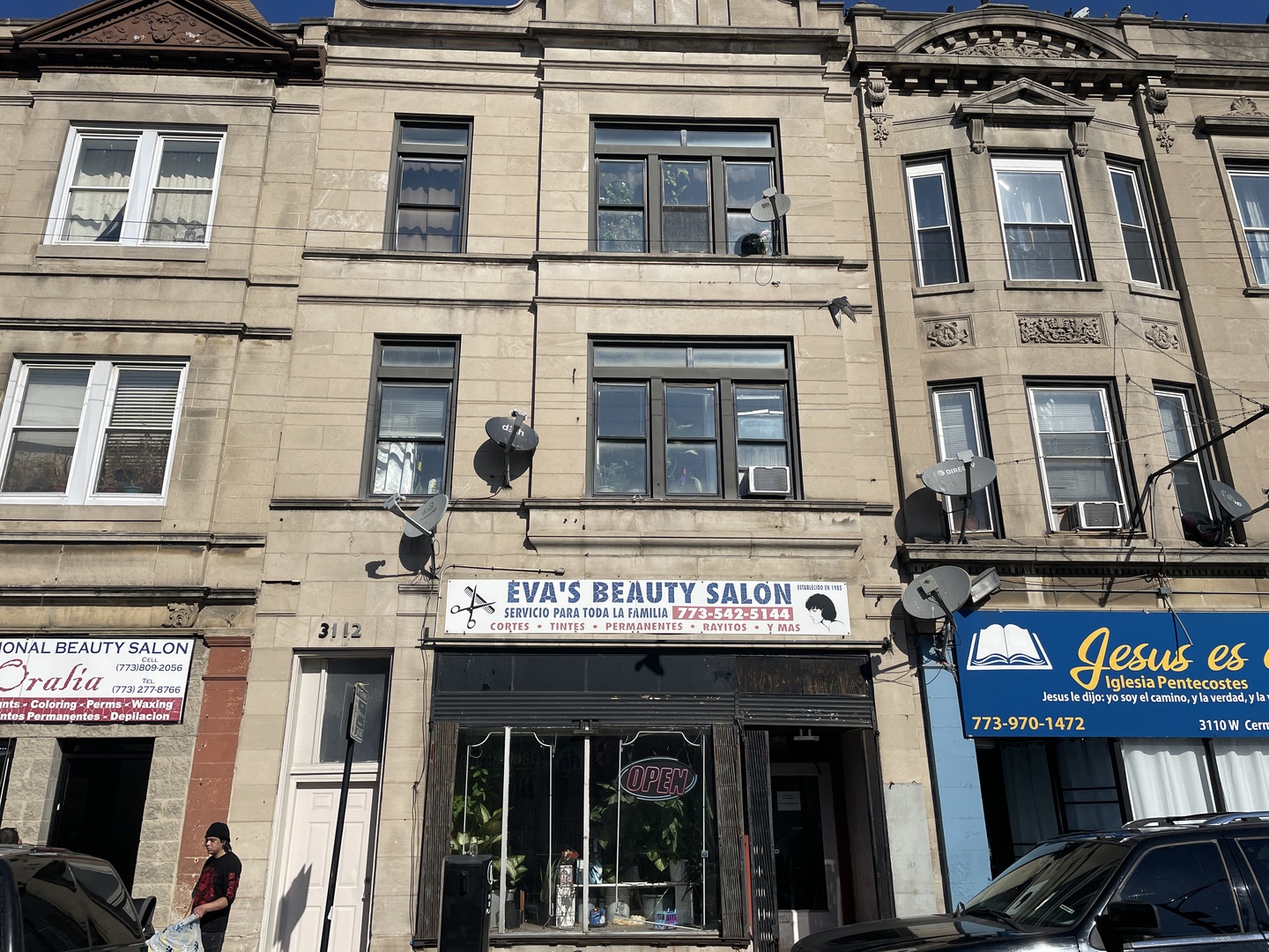 a view of a building with retail shop and windows