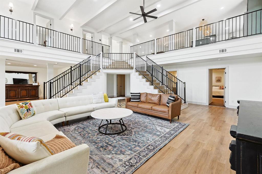 a living room with furniture and a rug