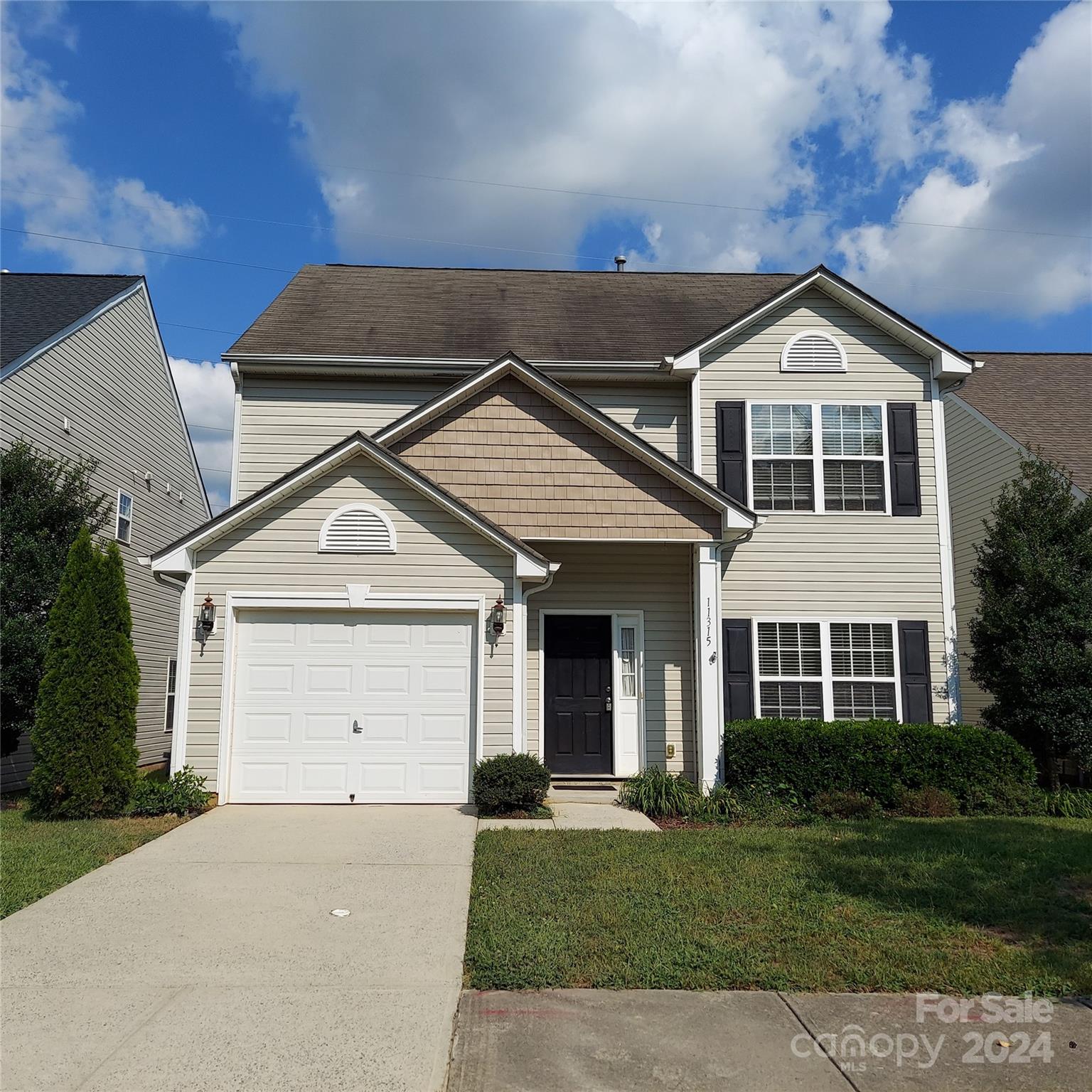 front view of a house with a yard