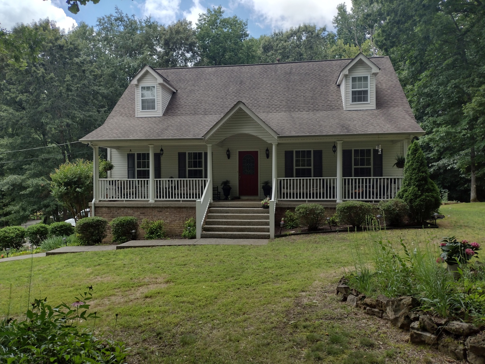 a front view of a house with a yard