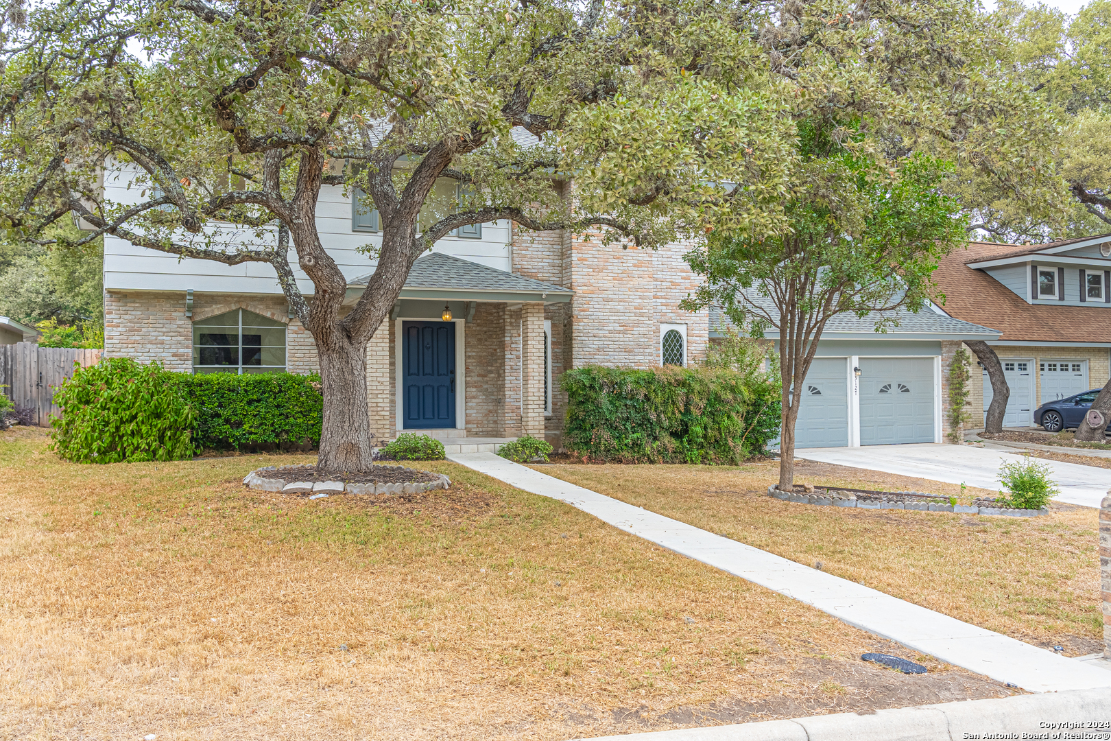 front view of a house with a yard