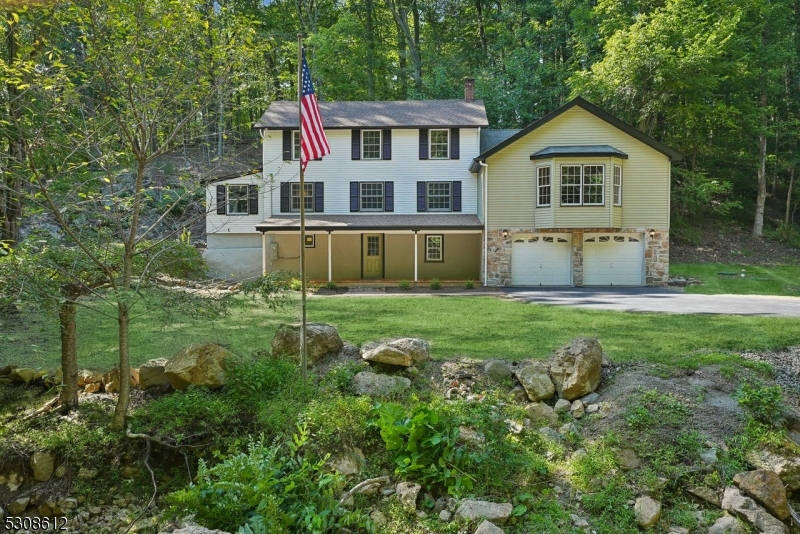 a view of house with yard