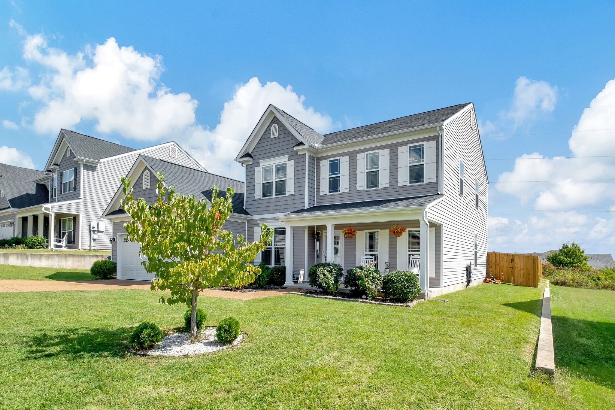 a front view of a house with a yard