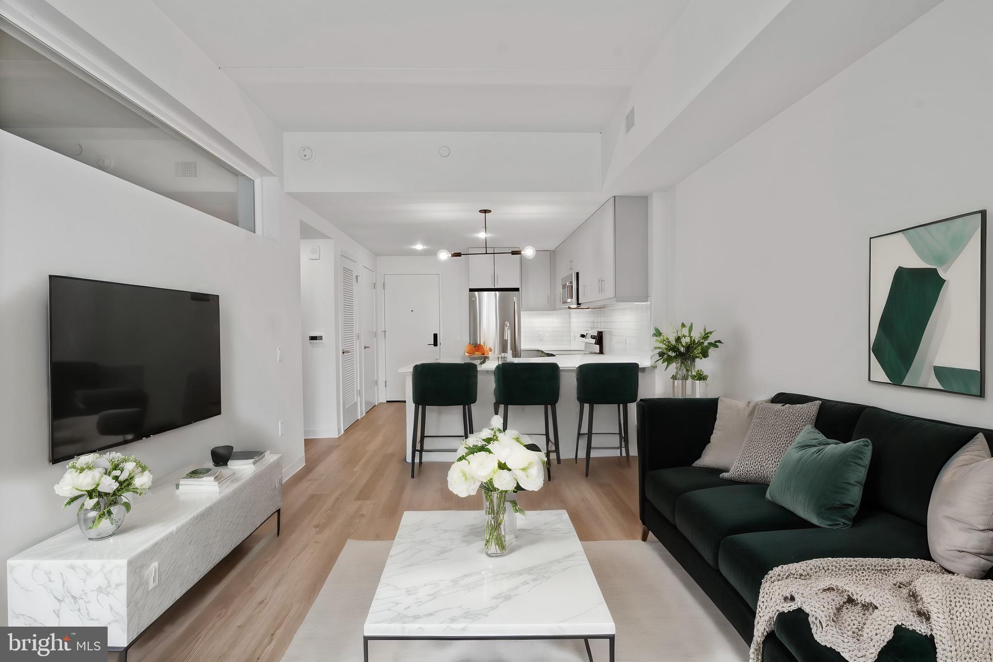 a living room with furniture and a flat screen tv