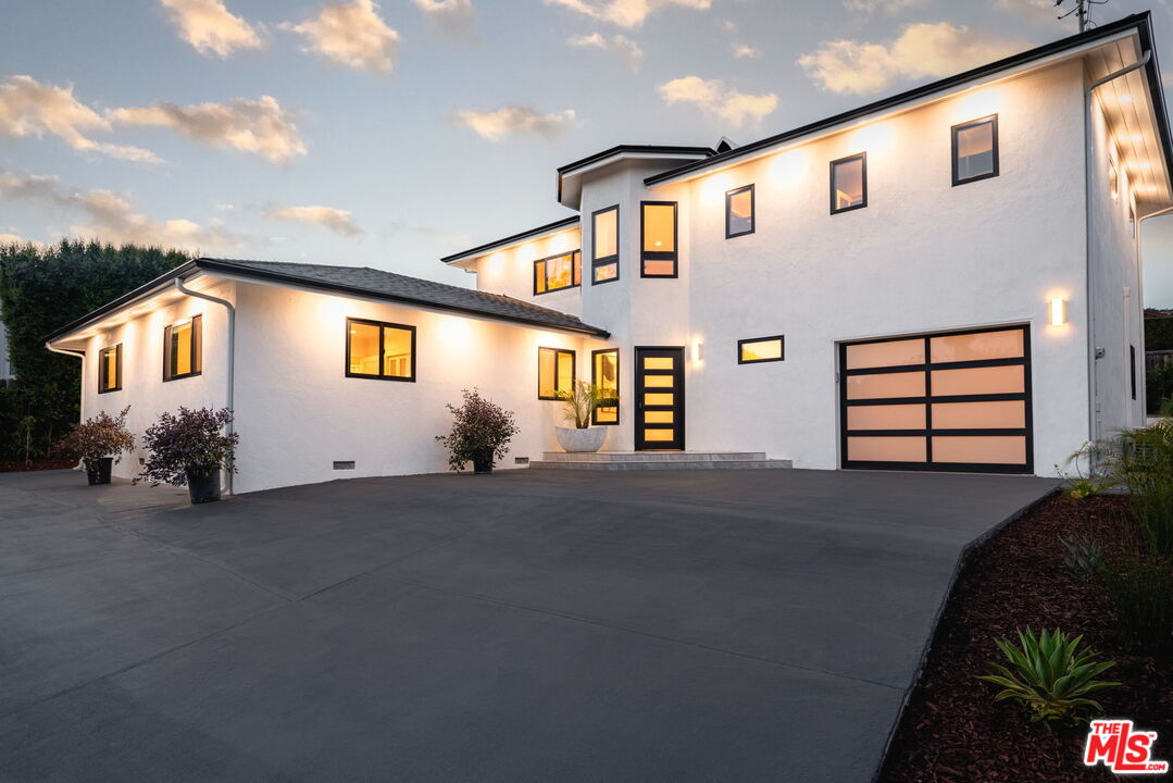 a front view of a house with a garage