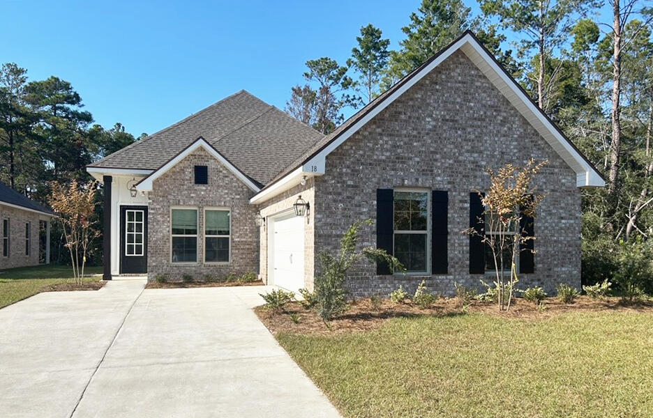 a view of house with yard