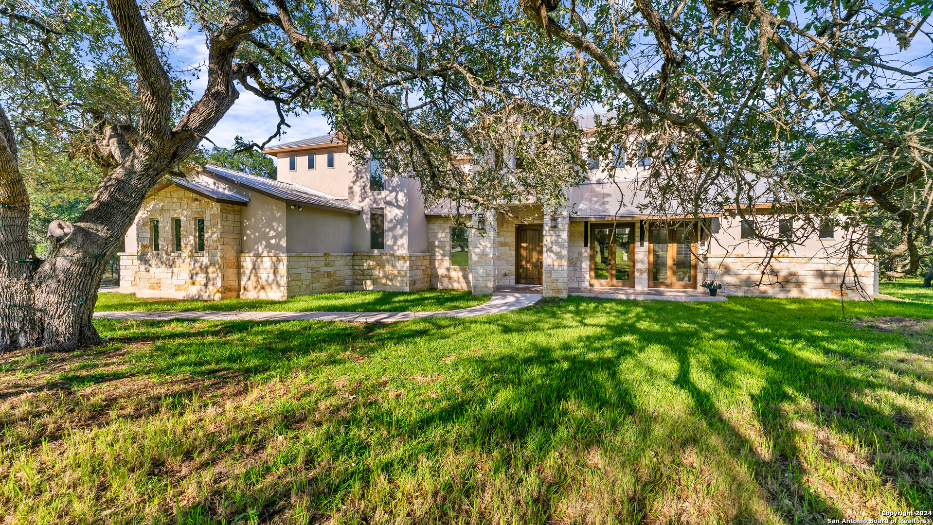 a front view of a house with garden