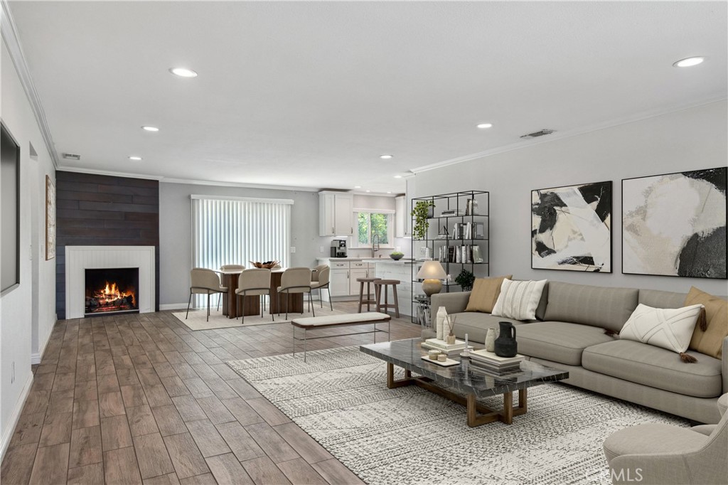 a living room with furniture and fireplace