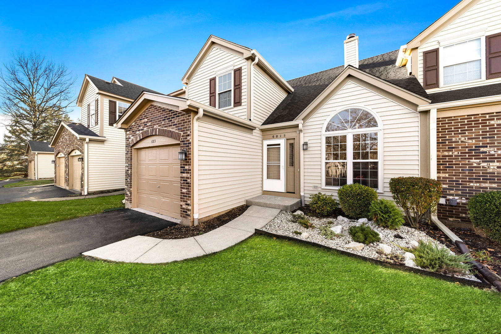 a view of a house with a yard and plants