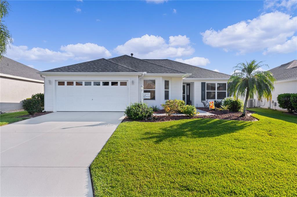 a view of a house with a yard