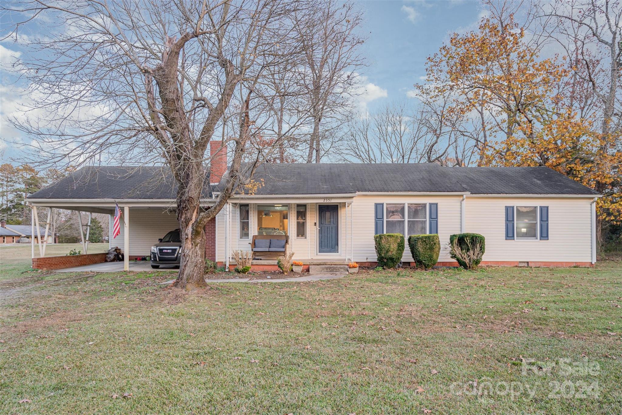 a front view of a house with a yard